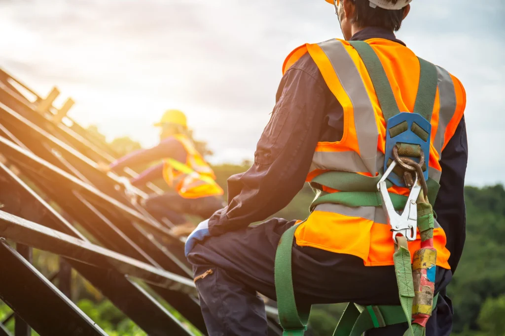 roof-safety-equipment-close-up-view-of-roofer-in-full-safety-gear-on-rafters